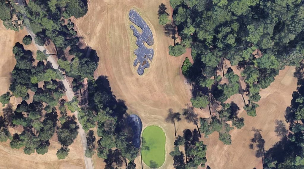 There's no bunker at Augusta quite like the (typically) bright-white expanse guarding the 10th green.