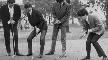 The Beatles playing golf