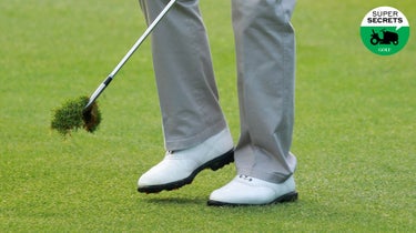 golfer carrying a divot