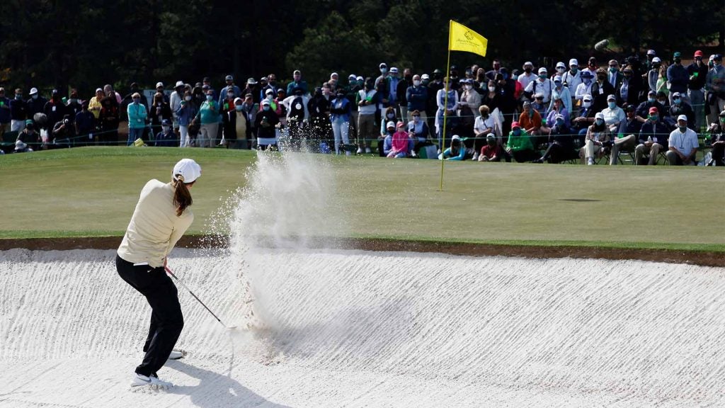 Emilia Migliaccio plays a shot out of the bunker during the playoff.