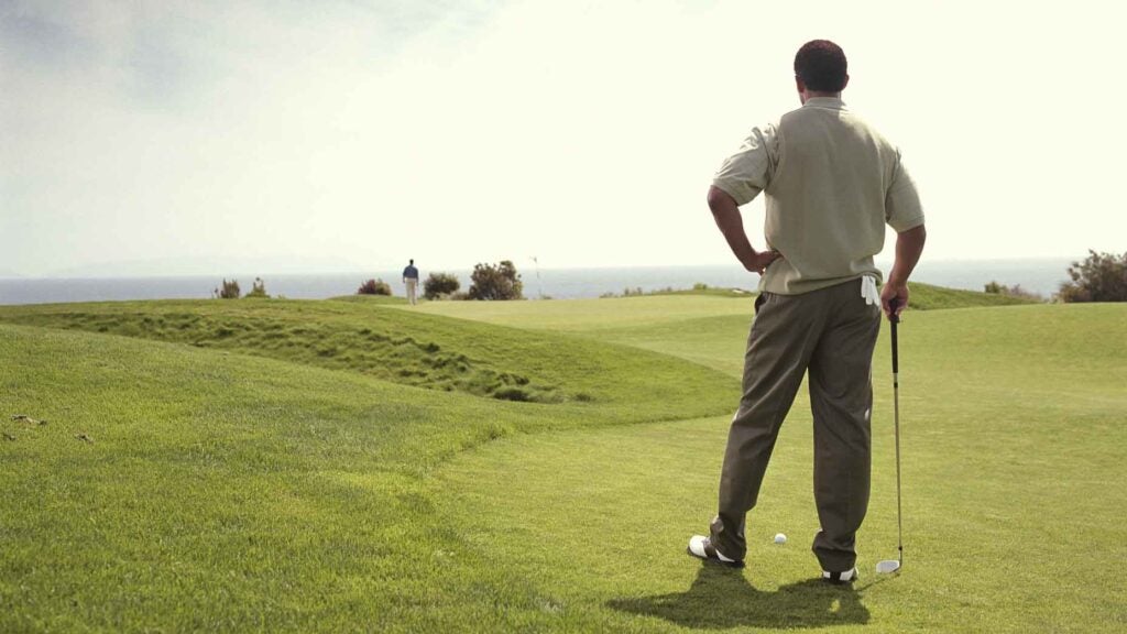 Golfer waiting on tee