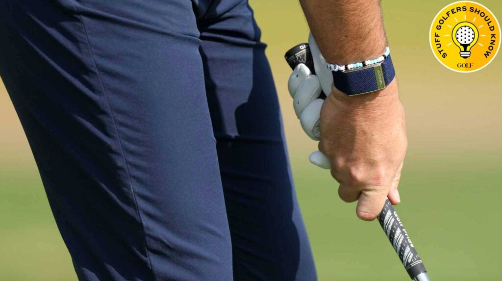 a golfer grips a golf club