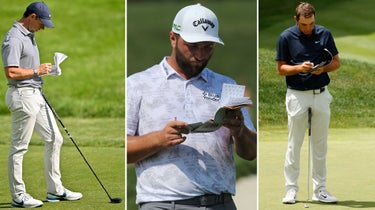 players looking at scorecards