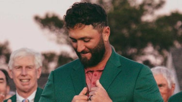 jon rahm admires his new masters green jacket