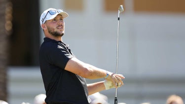 Josh allen watches a tee shot.