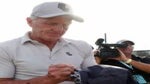 greg norman signs hat