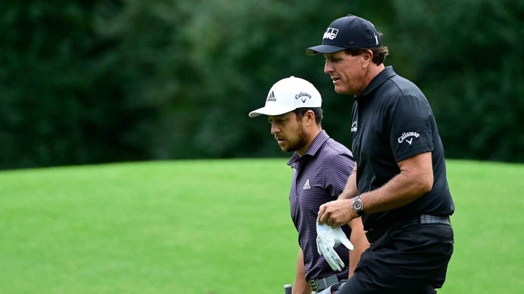 phil mickelson and xander schauffele walk