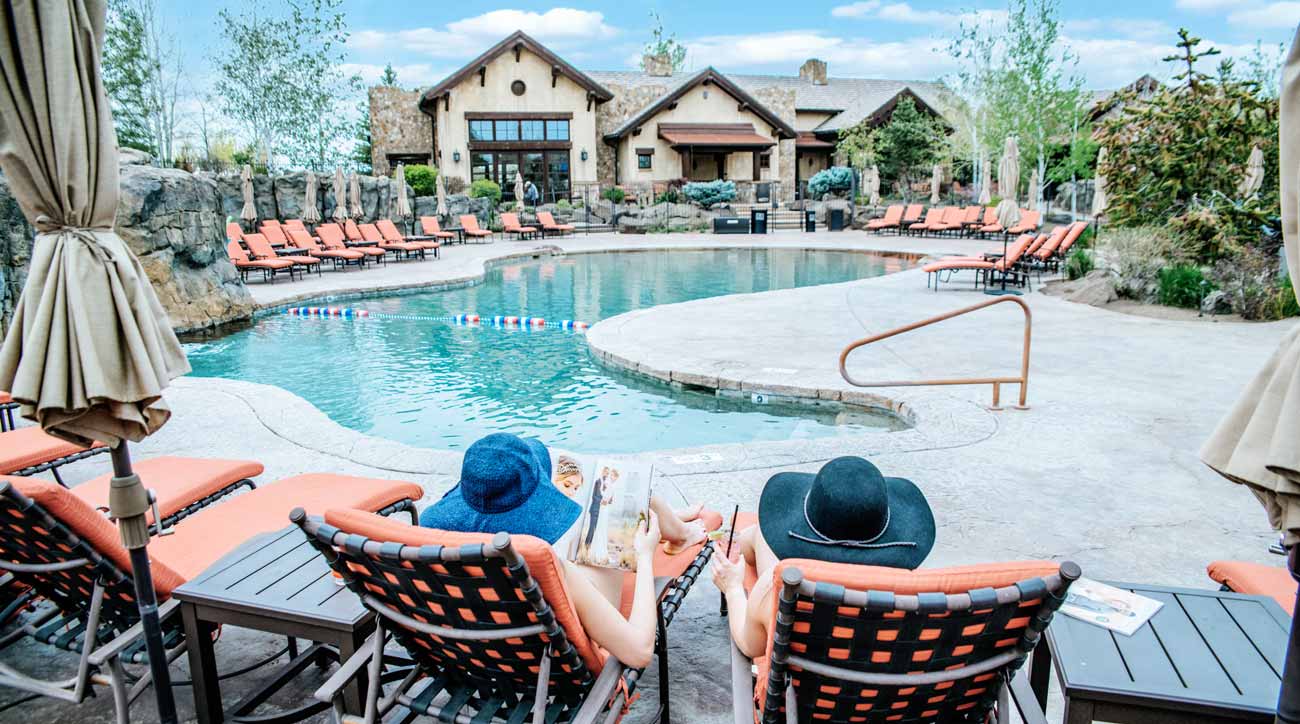 Guests relax poolside at Pronghorn Resort.