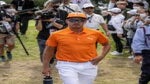 Rickie Fowler of the US (C) is pictured during the final round of the Zozo Championship golf tournament at the Accordia Golf Narashino Country Club in Inzai, Chiba prefecture on October 16, 2022.