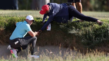 Rory McIlroy of Northern Ireland gets relief from an imbedded ball on the 14th green during the final round of the 123rd U.S. Open Championship at The Los Angeles Country Club on June 18, 2023 in Los Angeles, California.