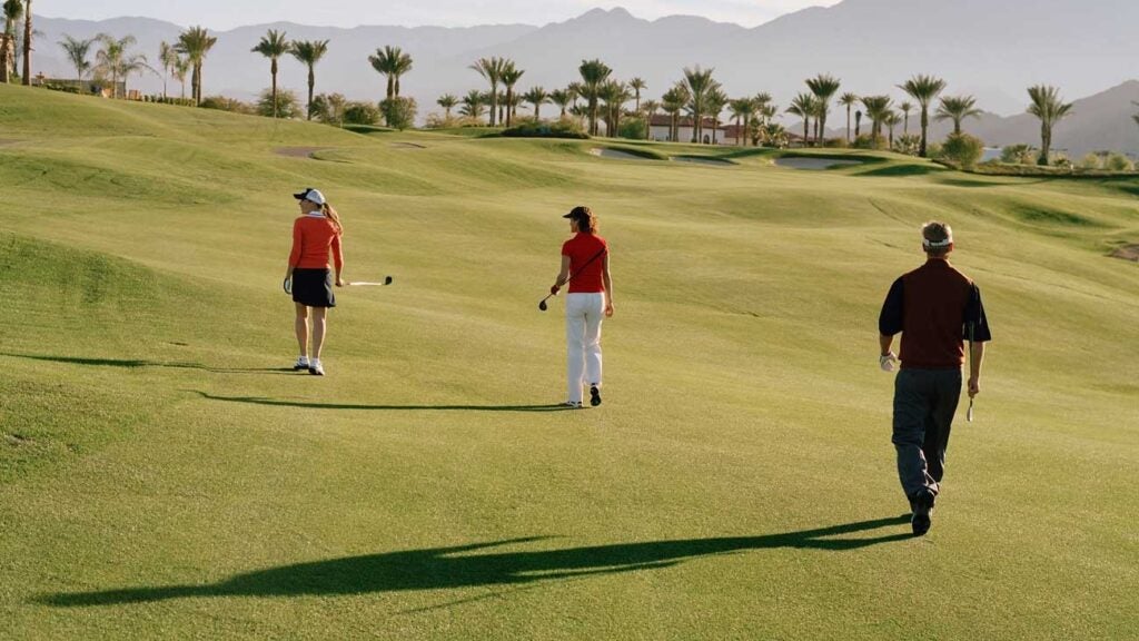 golfers walking in fairway