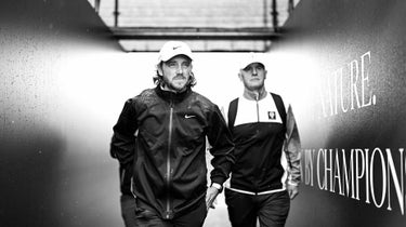 tommy fleetwood walks at the open