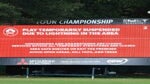 A leaderboard displays a message indicating a suspension of play due to inclement weather during the third round of the TOUR Championship at East Lake Golf Club on August 26, 2023 in Atlanta, Georgia.