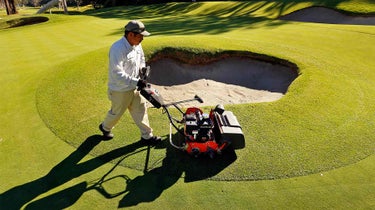 worker trims bunker no. 6 riviera